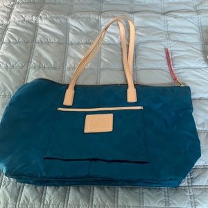 Coach tote with red/orange liner, gold zipper